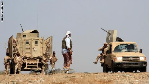 Yemeni loyalist forces patrol a highway near the Red Sea port town of Mocha_1.jpg?itok=cXX0iDIH